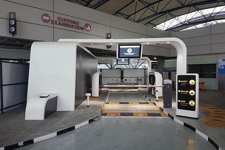 The ICA said the device in this photo taken at Tuas Checkpoint is actually a prototype of an Automated Passenger In-Car Clearance System.