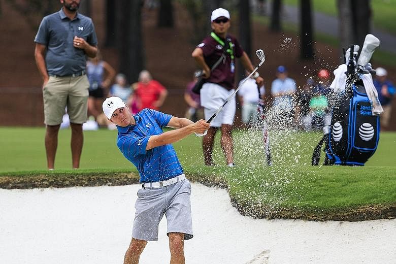 British Open champion Jordan Spieth hitting from a fairway bunker at the new fifth hole during a practice round for the PGA Championship at Quail Hollow.