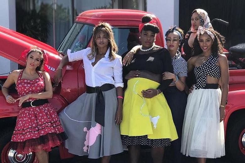 Tennis star Serena Williams' pregnancy playbook included throwing a baby shower last weekend, where the theme was a smashing retro return to the 1950s, including poodle skirts. Having a ball in this picture are (from far left) actress Eva Longoria, s