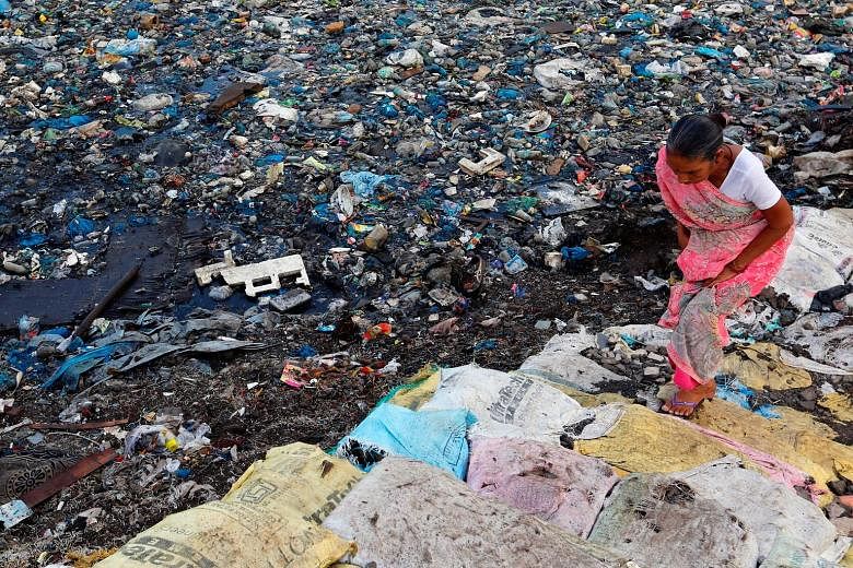 A polluted water canal at an Indian slum. India's slum dwellers have long opposed efforts to relocate them to distant suburbs that limit their access to jobs and amenities. Instead, they favour development with upgrading of facilities and secure tena
