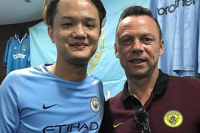 Manchester City FC Supporters Club Singapore treasurer Jess Chen with former City player Paul Dickov. Chen feels that David Silva will be crucial to this season's success.