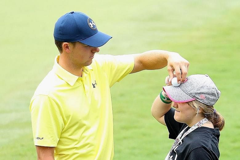 Jordan Spieth with his sister Ellie during a practice round on Tuesday, prior to the start of the PGA Championship at Quail Hollow Club in Charlotte, North Carolina. The American has the momentum after his dramatic Open victory, but Rory McIlroy has 