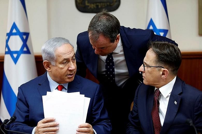 Mr Benjamin Netanyahu (far left) with his advisers at a weekly Cabinet meeting. Suddenly, the long-serving Israeli leader seems not so invincible after all.