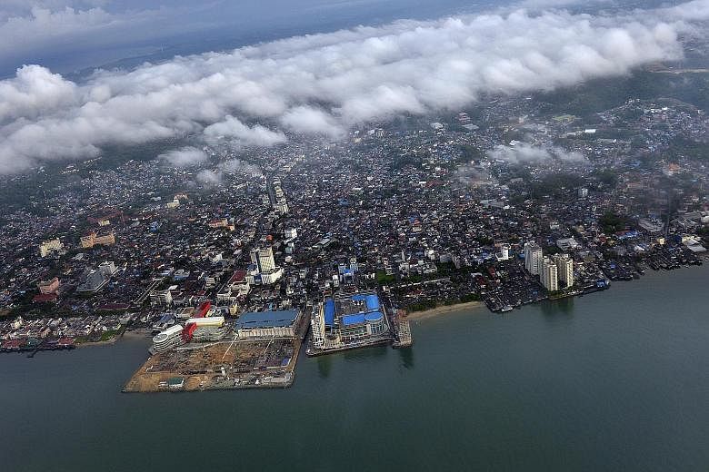 Some urban planning experts argue that the coastal town of Balikpapan (above) in East Kalimantan province makes a better choice compared with Palangkaraya, which is prone to fires owing to its abundant peatlands and was at the centre of the 2015 haze