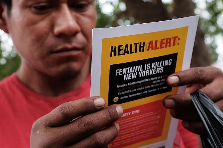 A heroin user in New York City reading an alert on fentanyl, which, data shows, is one of the opioids linked to US drug overdoses.