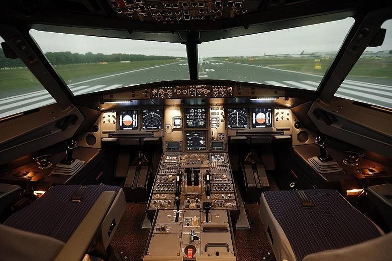A full-flight simulator at the Airbus Asia Training Centre. In April last year, SIA opened its first pilot training school at Seletar Aerospace Park, in a joint venture with plane-maker Airbus.