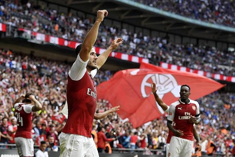 Arsenal left-back Sead Kolasinac celebrating his Community Shield equaliser against Chelsea at Wembley, where they went on to win 4-1 on penalties. The Gunners will be playing in the Europa League this season, having failed to qualify last term for t