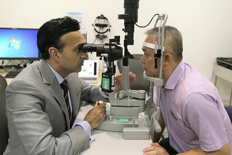 Associate Professor Jodhbir Mehta, head and senior consultant at SNEC's corneal and external eye disease department, with Mr Tan Beng Wee, who lived with pterygium for 30 years before going for Flaps last year.