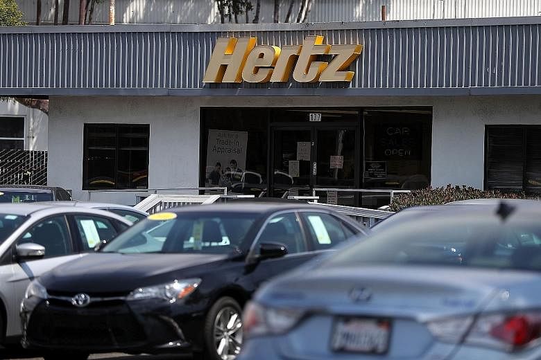 Hertz shares rose more than 13 per cent after it was reported that the car-rental company has cut a deal with Apple to lease Lexus sport utility vehicles.