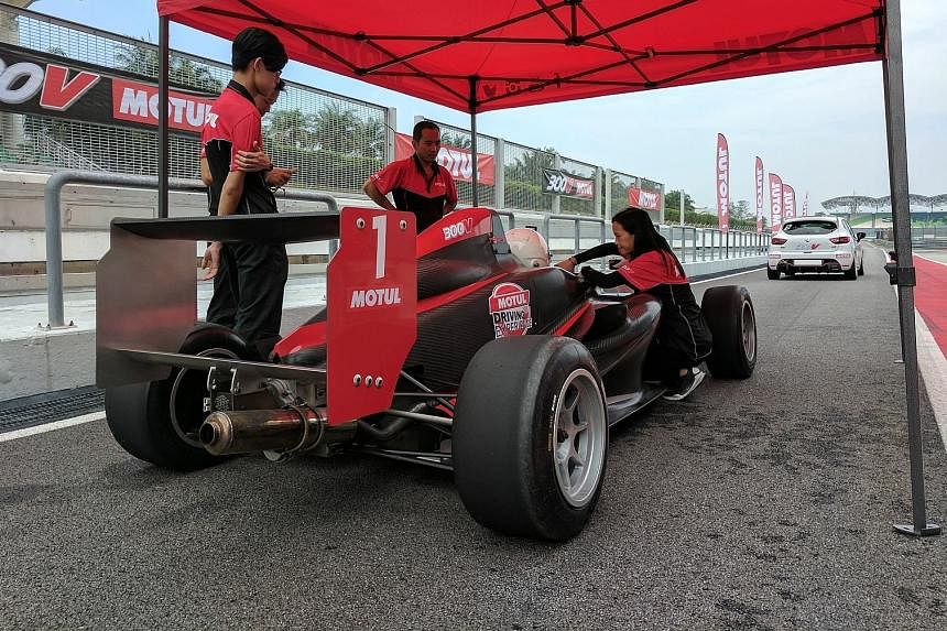 A Formula Four car has 160 horsepower and comes with wings that generate aerodynamic grip.