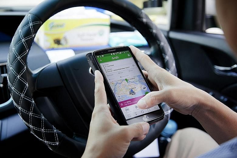 A Grab driver uses the Grab app on a smartphone. There are at least 38,000 private-hire car drivers on Singapore roads today, going by the number of private-hire driver vocational licence applications approved by the LTA. Taxi driver Armstrong Ho bel