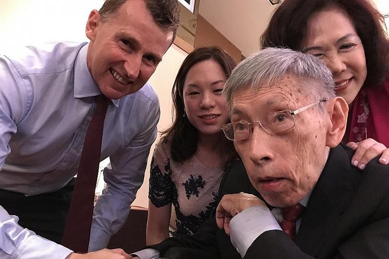 Former Member of Parliament for Potong Pasir Chiam See Tong posing for a wefie with his wife Lina, daughter Camilla and rugby referee Nigel Owens at a charity gala dinner last night for the sports foundation that bears the veteran politician's name. 