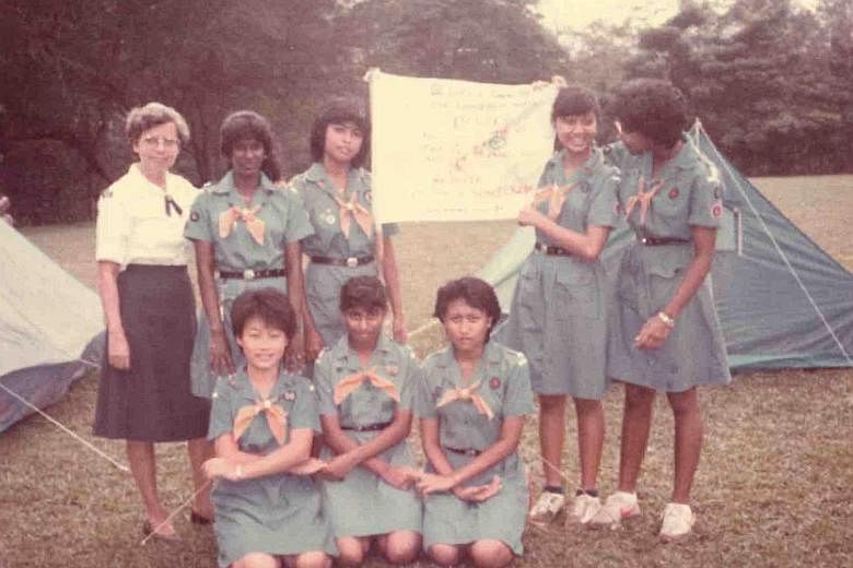 Above: Ms Alvis with some Girl Guides in the 1960s.
