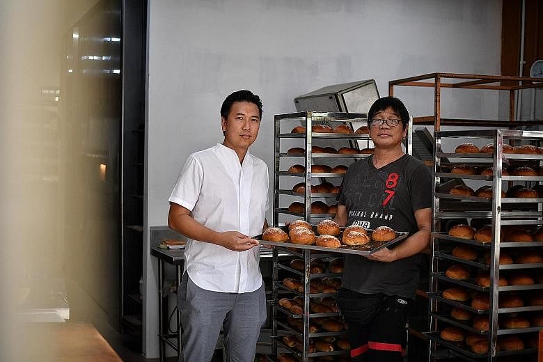 Above: Swiss tourists Gisela Aeschbach and Fredy Diener at Jie Bakery, with owner Jimmy Mah, as part of Tribe's Disappearing Trades tour. Right: Tribe co-founder Jason Loe with Mr Mah, who enjoys opening up his bakery to visitors as he has many stori