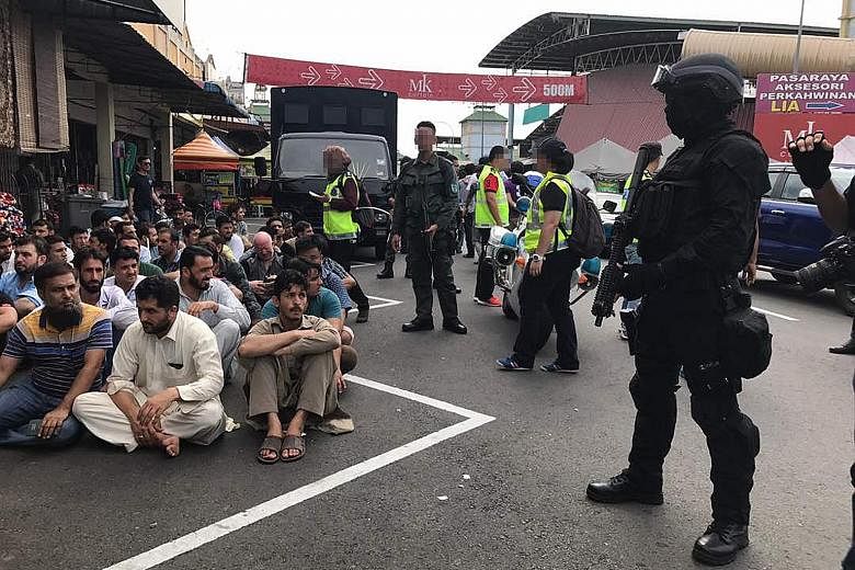 Hundreds of migrant workers were detained yesterday in a security sweep in commercial centre Nilai 3 in Negeri Sembilan state. Police say they were targeting suspected fighters of the ISIS-K, the Khorasan chapter of ISIS. Those nabbed were mainly fro