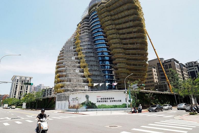 The Tao Zhu Yin Yuan apartment block in Taipei's Xinyi district is a green building that conserves energy, recycles rainwater and sucks up carbon dioxide emissions. The twist ensures that all 40 apartments will get sunshine. The building will be comp