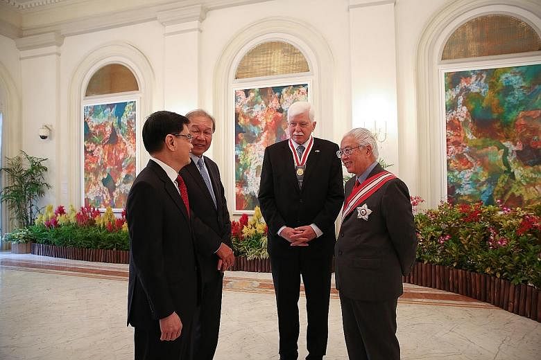 Emeritus Professor Ulrich Werner Suter (second from right) with President Tony Tan Keng Yam, Finance Minister Heng Swee Keat (far left) and NRF chief executive Low Teck Seng at the Istana. The Honorary Citizen Award is the highest form of recognition