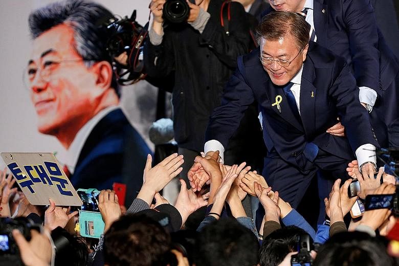 Mr Moon Jae In thanking supporters at Gwanghwamun Square in Seoul on May 10, when he assumed office as South Korean President.