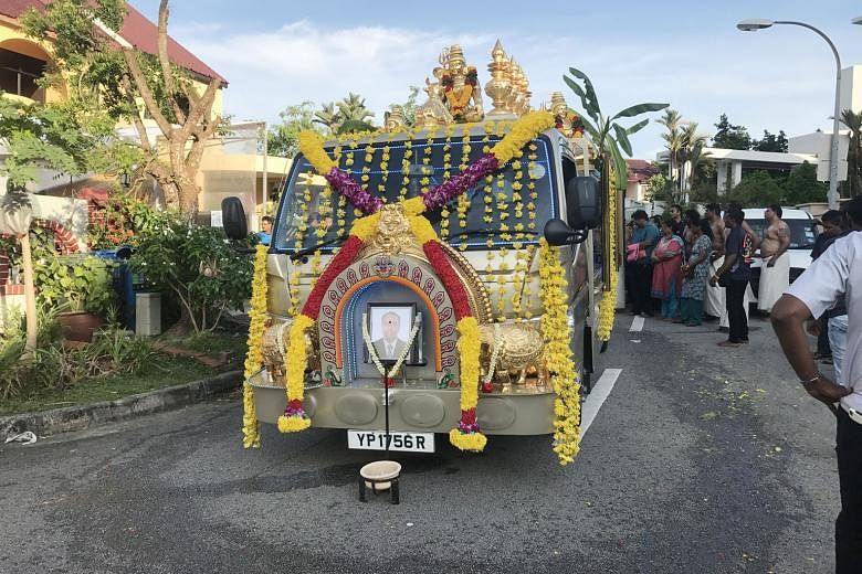 The hearse that will bear Mr Rajadanran Suppiah's body at the wake in Lentor Terrace. Mr Rajadanran died of cardiac arrest after collapsing while jogging along the MacRitchie Nature Trail last Saturday.