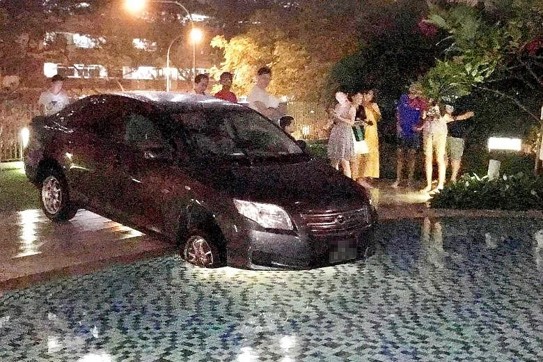 The car was left at the edge of SkyPark Residences' pool, with its front two tyres in the water on Aug 8. It was towed out at about 1am on Aug 9. The condo's management committee is conducting a review to see if more signage is required.