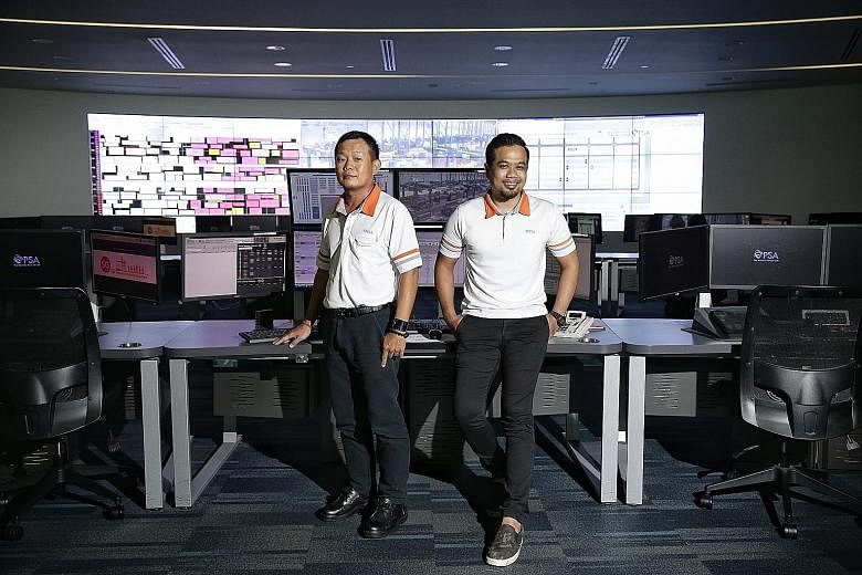 Mr Kenny Tan (left), a 51-year-old container equipment specialist, and Mr Mohamed Khairul, a 30-year-old operations controller, are enjoying their new roles after moving from from Tanjong Pagar Terminal to Pasir Panjang Terminal last year.