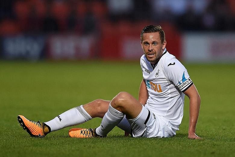 Swansea midfielder Gylfi Sigurdsson is in limbo, having been left out of the Swans' league opener against Southampton, with a mooted move to Everton yet to materialise.