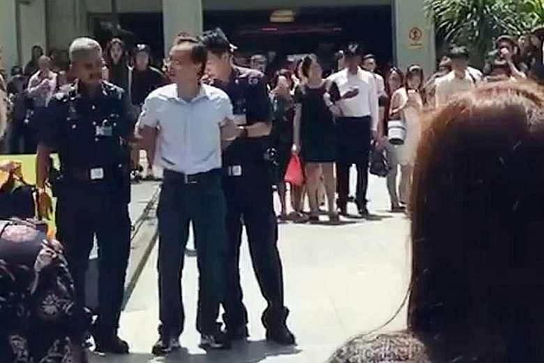 Yan Jun held a demonstration and behaved in a disorderly manner outside Raffles Place MRT station on July 4. He refused to stop shouting at police officers via a loudhailer when told to do so.