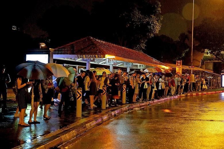 The crowd at the bus stop along Bishan Road, next to the Bishan MRT station, which is on the North-South Line, at about 8pm yesterday.