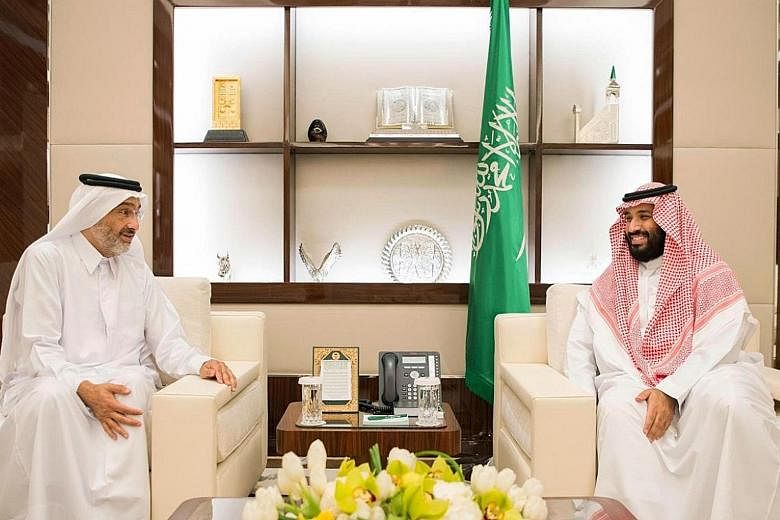 Saudi Crown Prince Mohammed bin Salman (at right) with Qatari envoy Sheikh Abdullah bin Ali bin Jassim al-Thani in Jeddah on Wednesday. Prince Mohammed emphasised the "historical relations between Saudi and Qatari people" after his meeting with the e