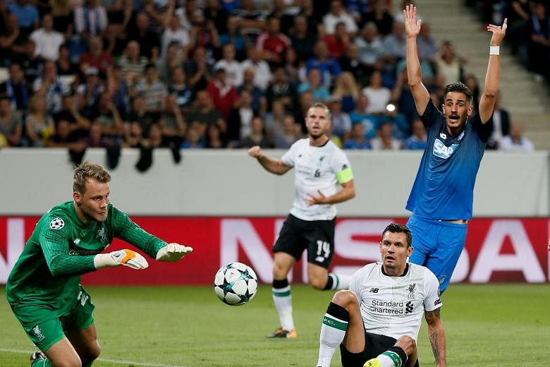 Simon Mignolet smothering the ball in the 2-1 win against Hoffenheim in the first leg of their Champions League play-off encounter on Tuesday. The Reds led 2-0 before the German side pulled one back late. Jurgen Klopp's team have conceded four goals 