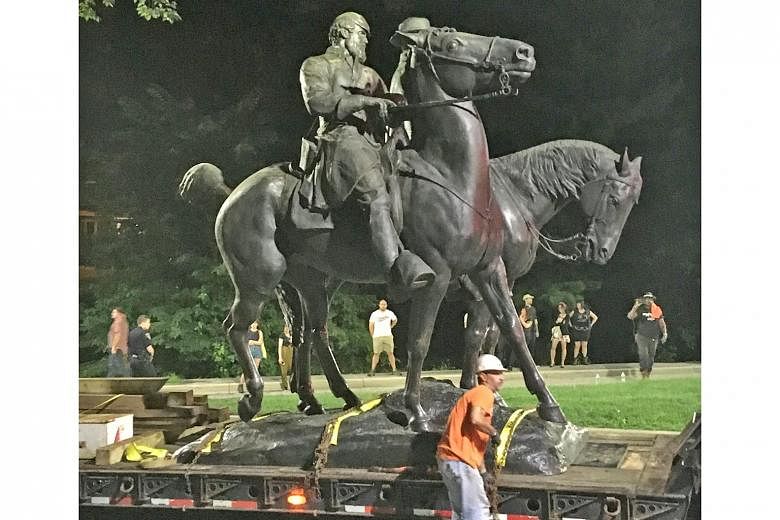 A statue of Confederate General Robert E. Lee was among four statues removed from Wyman Park in Baltimore, Maryland, on Wednesday under the supervision of Baltimore Mayor Catherine Pugh. In Birmingham, Alabama, another Confederate monument was covere