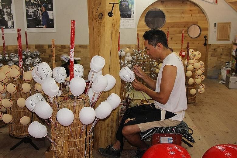 Merlion-inspired Daruma dolls being made for the second edition of Singapore: Inside Out.