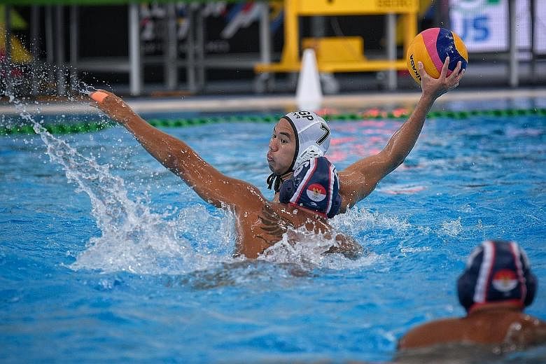 Singapore's Chiam Kun Yang shooting past Indonesia's Benny Respati in their SEA Games men's water polo round-robin match. Chiam scored two goals while Benny netted once in the 4-4 draw.
