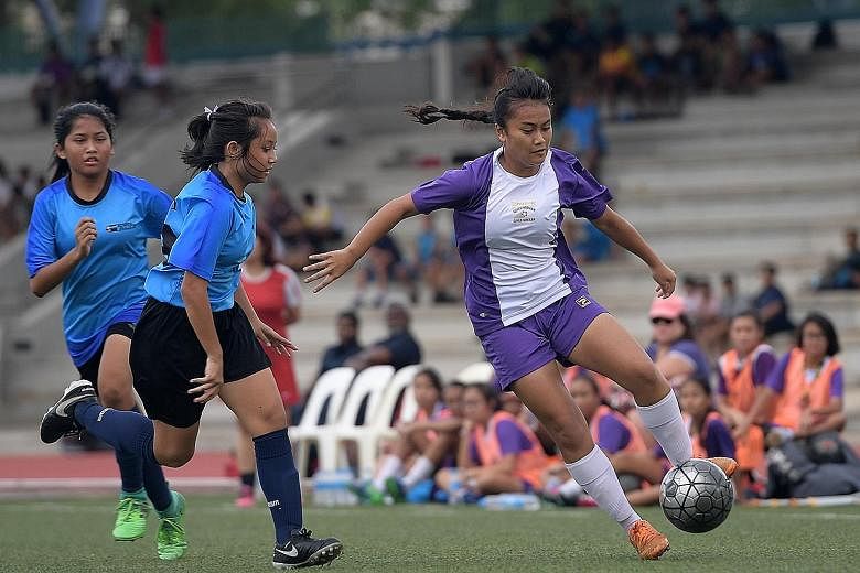 Tournament favourites Queensway Secondary School clinched the Schools National C Division girls' football title yesterday, beating rivals Bowen Secondary School 1-0 in a tense affair. Golden boot winner Putri Nur Syaliza (in purple), who scored an in
