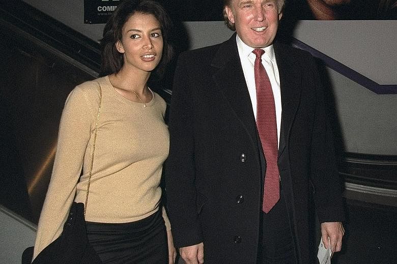 Biracial model Kara Young, seen here with Mr Donald Trump in 1998, said she never heard him make a disparaging comment about any race.