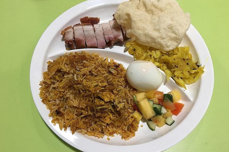 The siew yoke biryani fuses the Persian-Indian rice dish with Cantonese-style roast pork belly.
