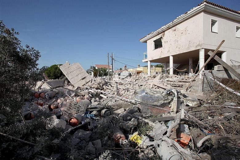 Above: The ruins of a house that collapsed in Alcanar, Spain, last Wednesday after an explosion. The blast, the police suspect, was the result of a mistake by plotters, who had intended to make a powerful bomb, place it in a van and detonate it in th
