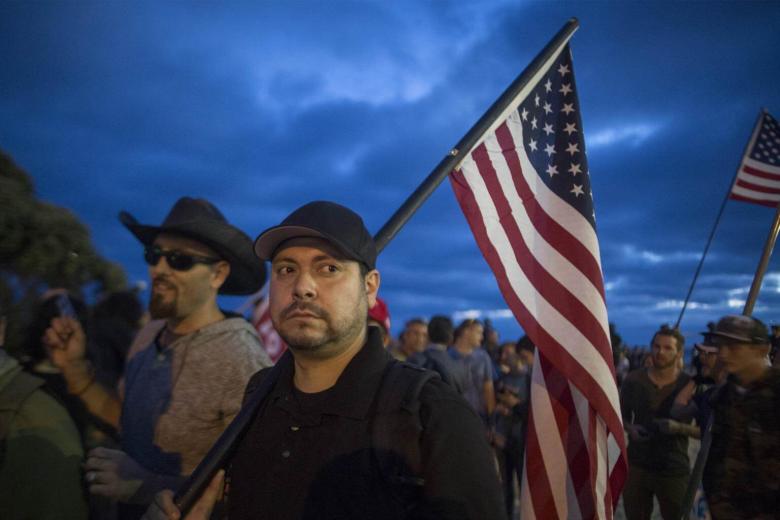 'America First' protesters face off with opponents at California beach