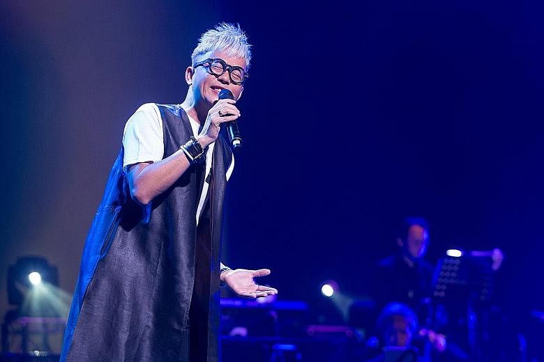 A group performance at the Xinyao 35 Reunion Concert at The Star Theatre last Saturday; veteran songwriter Ng King Kang (above) and singer-songwriter Roy Loi at the concert.