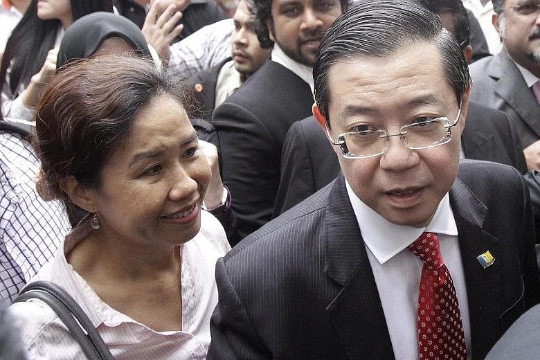 Democratic Action Party secretary- general Lim Guan Eng and his wife, Madam Betty Chew. Today, Mr Lim leads Malaysia's largest opposition party, including many who are fanatically loyal to him despite recent setbacks.