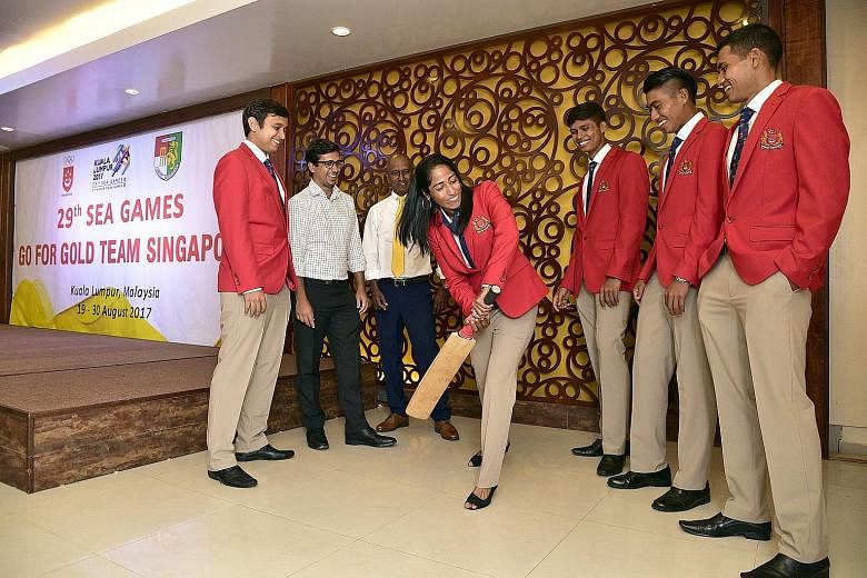 Navin Param, Diviya G.K (centre), James Muruthi, Anish Paraam and Prasheen Param are representing Singapore in cricket in KL.