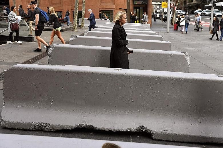 The plan's measures include barriers to prevent vehicles entering pedestrian areas, like these near the Lindt Cafe, the scene of a siege in 2014.