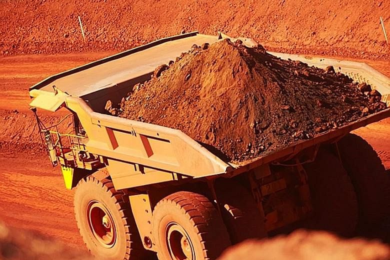 Iron ore being trucked out of a mine at Mount Newman in Western Australia. Miner BHP Billiton reported a surge in profits yesterday on the back of stronger commodity prices.