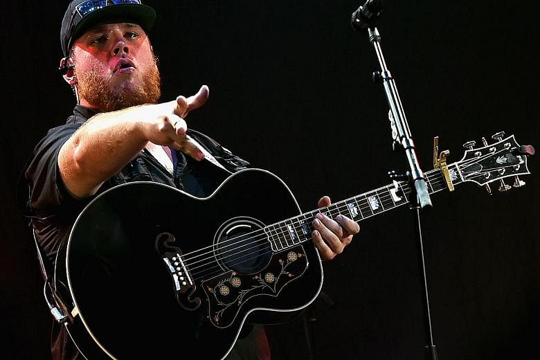 Mr John Marks, global head of country programming at Spotify, says the streaming service helps unearth talents such as Luke Combs (left), whose debut single, Hurricane, reached No. 1 on the Billboard Country Airplay chart.