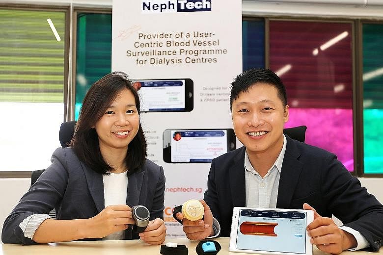 NephTech co-founders Toh Yanling and James Lim, with prototypes of their product - a blood-vessel monitoring device that can be linked to a tablet via Bluetooth.