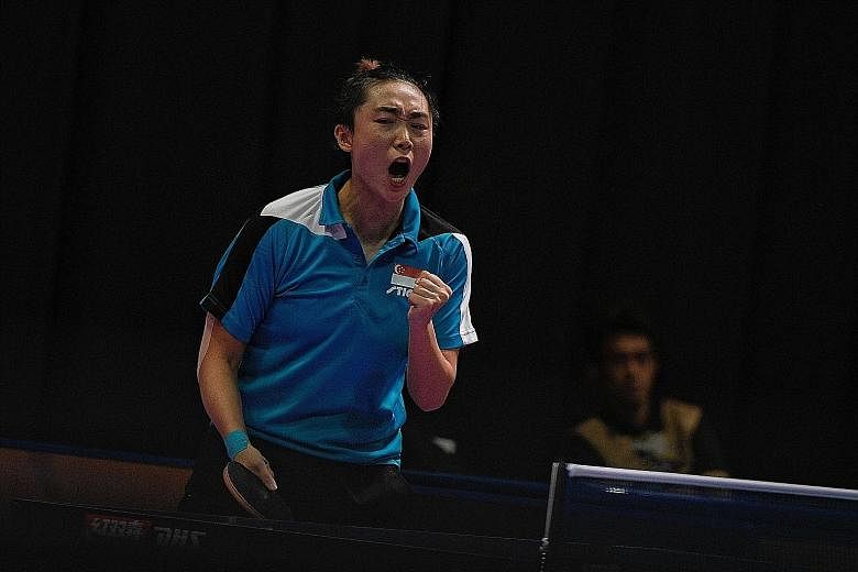 Feng Tianwei reacts during her women's singles final against fellow Singaporean Zhou Yihan. She won 9-11, 11-6, 7-11, 11-9, 12-10, 13-11 for a gold that "has a lot of significance".