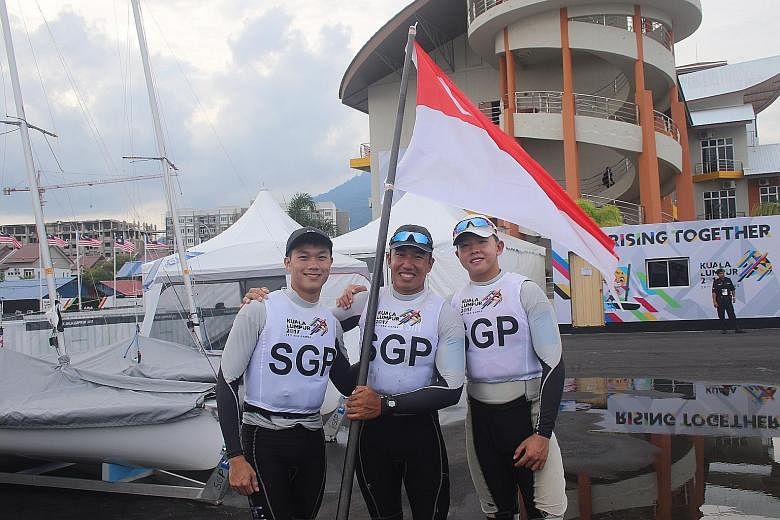 (From left) Bernie Chin, Mark Wong and Ryan Lo teamed up to win the Laser Standard, beating the experienced Malaysian sailors 2-0 in the final after a 1-1 round-robin tie.