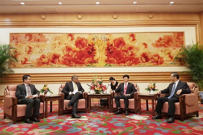 Chief Justice Sundaresh Menon (second from left) with (from left) Supreme People's Court president Zhou Qiang; secretary of Chinese Communist Party's Political and Legal Affairs Commission, Mr Meng Jianzhu; and Singapore Ambassador Stanley Loh.