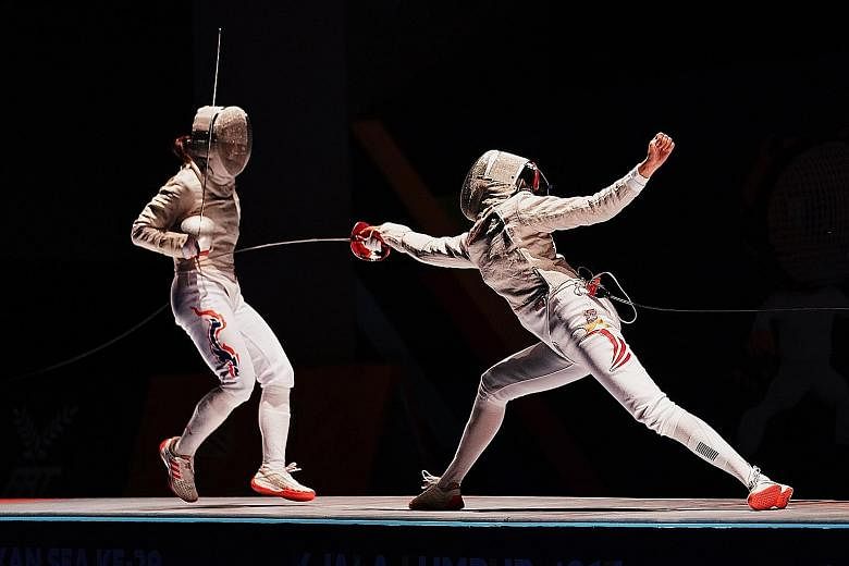 Lau Ywen attacking Thailand's Pornsawan Ngernrungruangroj in the individual sabre final. The reigning Sportsgirl of the Year won 15-12 to clinch her first SEA Games gold medal.
