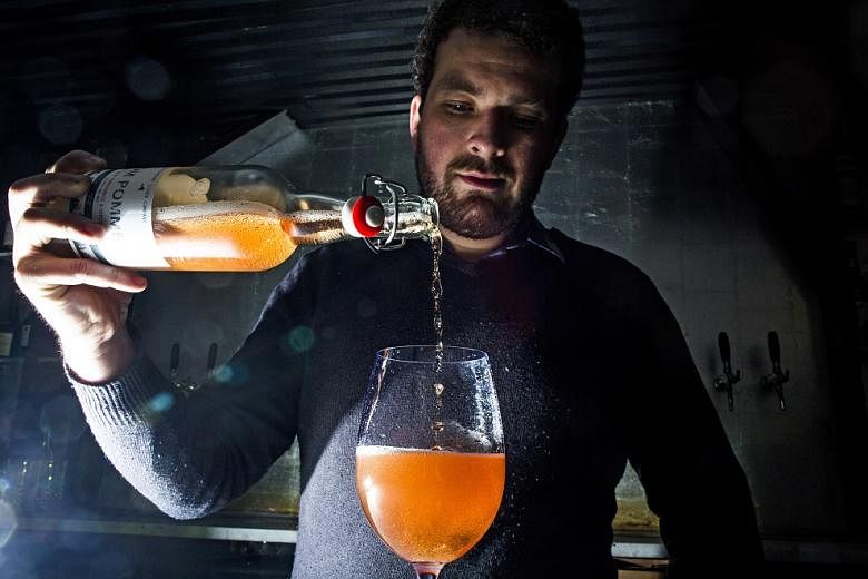 Beverage consultant Dan Pucci pours a cider at the restaurant Wassail, where he was once the pommelier, or cider director, in New York, in March 2017. 